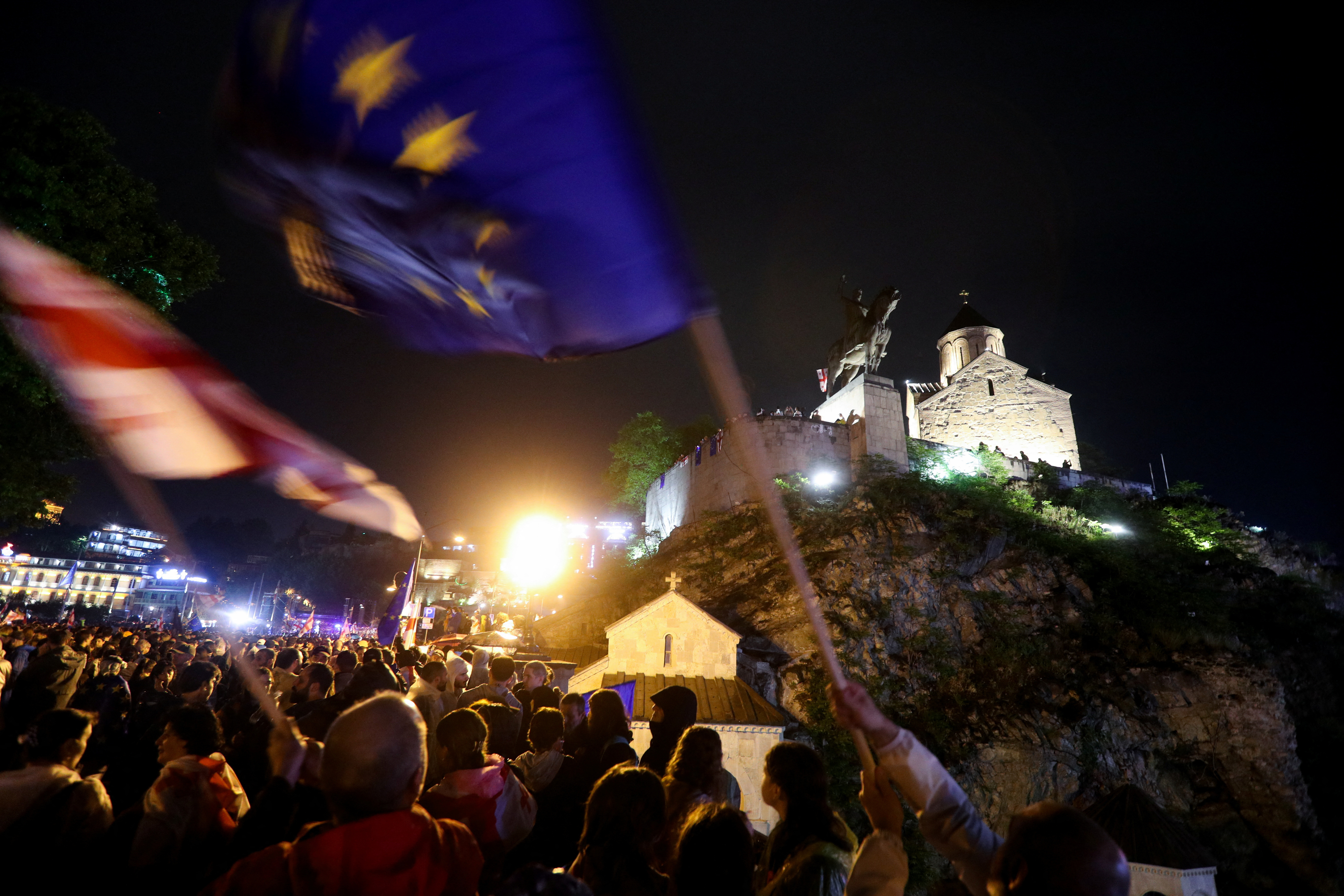 Demonstrators hold a rally to protest against a bill on "foreign agents" in Tbilisi
