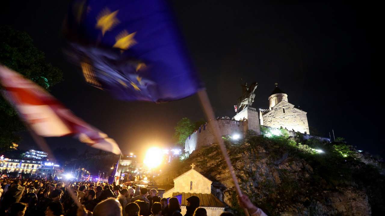Demonstrators hold a rally to protest against a bill on "foreign agents" in Tbilisi