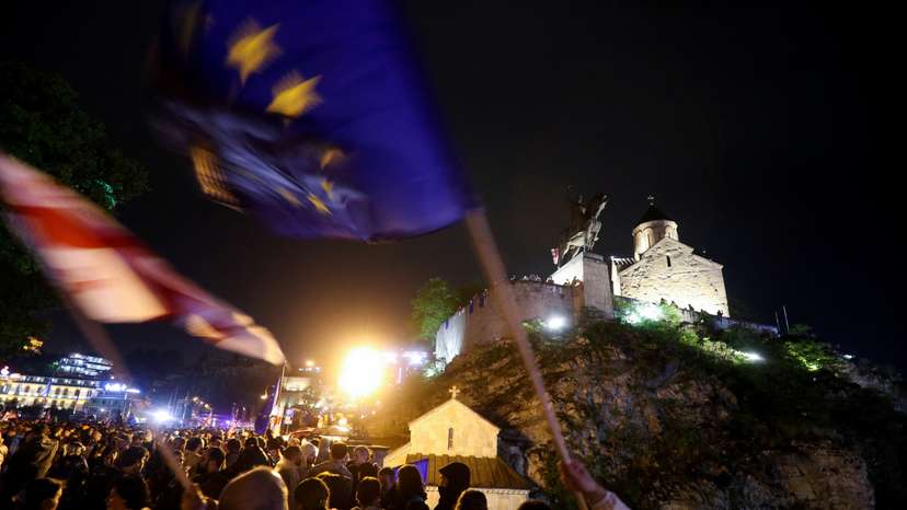 Demonstrators hold a rally to protest against a bill on "foreign agents" in Tbilisi