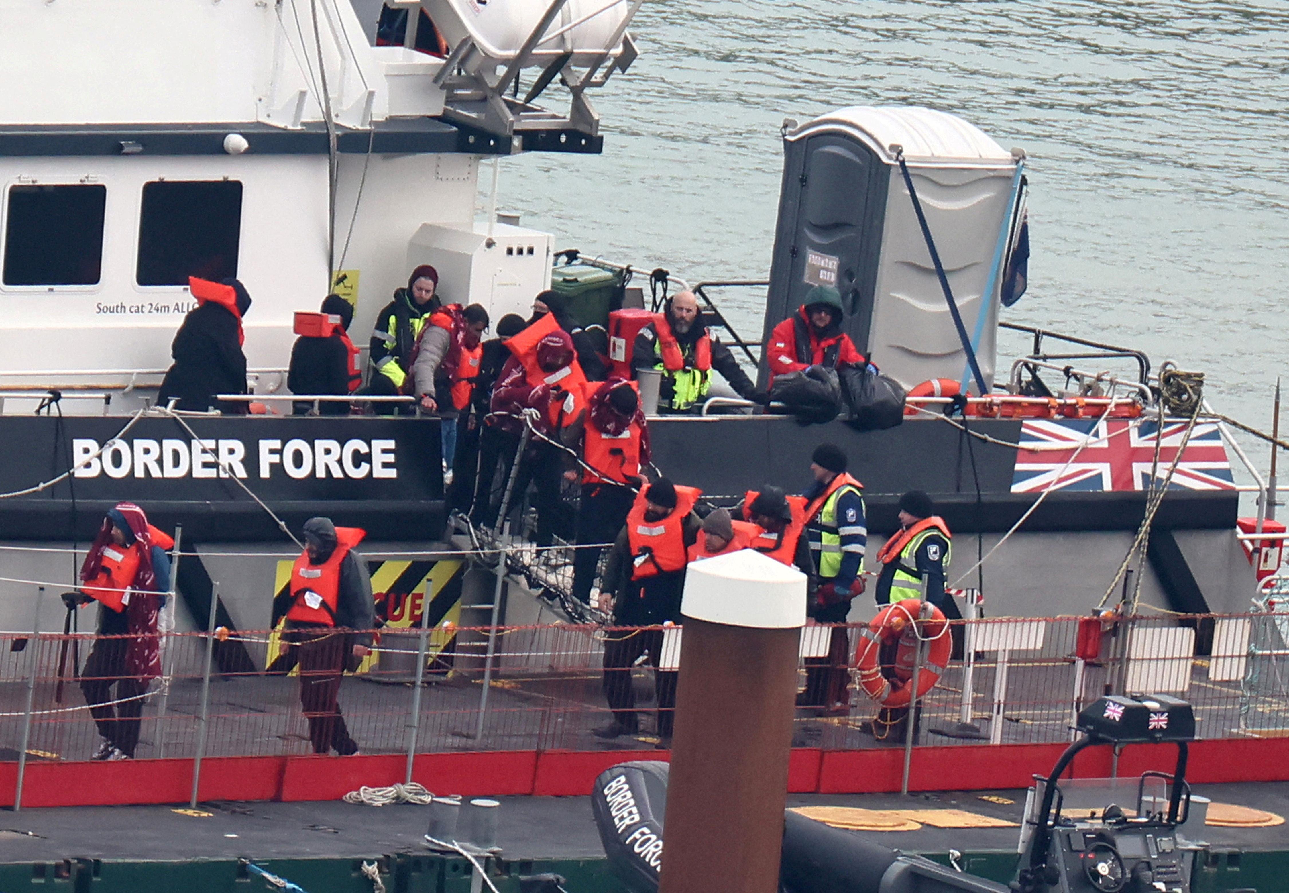 FILE PHOTO: People, believed to be migrants, arrive at Port of Dover, Dover