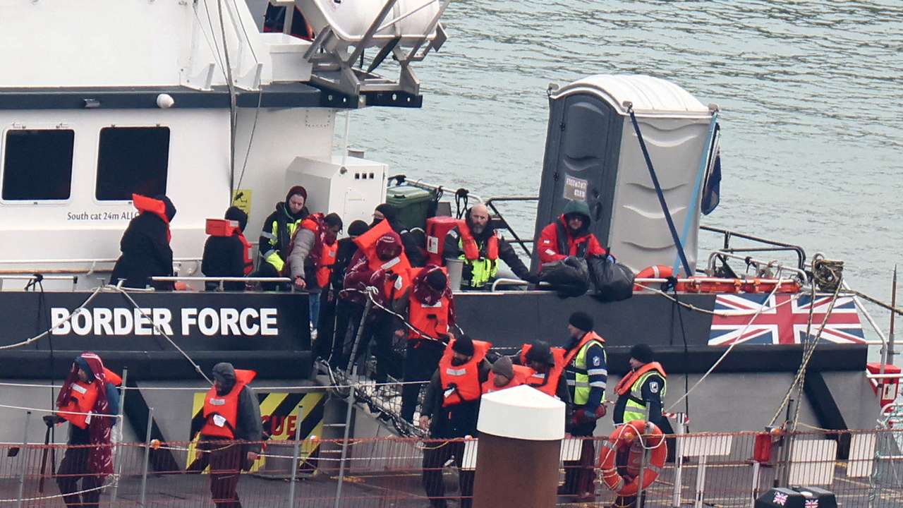 FILE PHOTO: People, believed to be migrants, arrive at Port of Dover, Dover