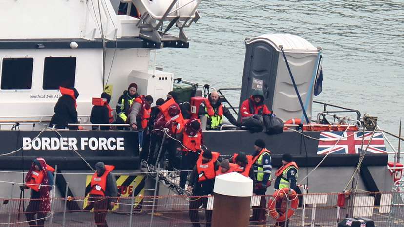 FILE PHOTO: People, believed to be migrants, arrive at Port of Dover, Dover