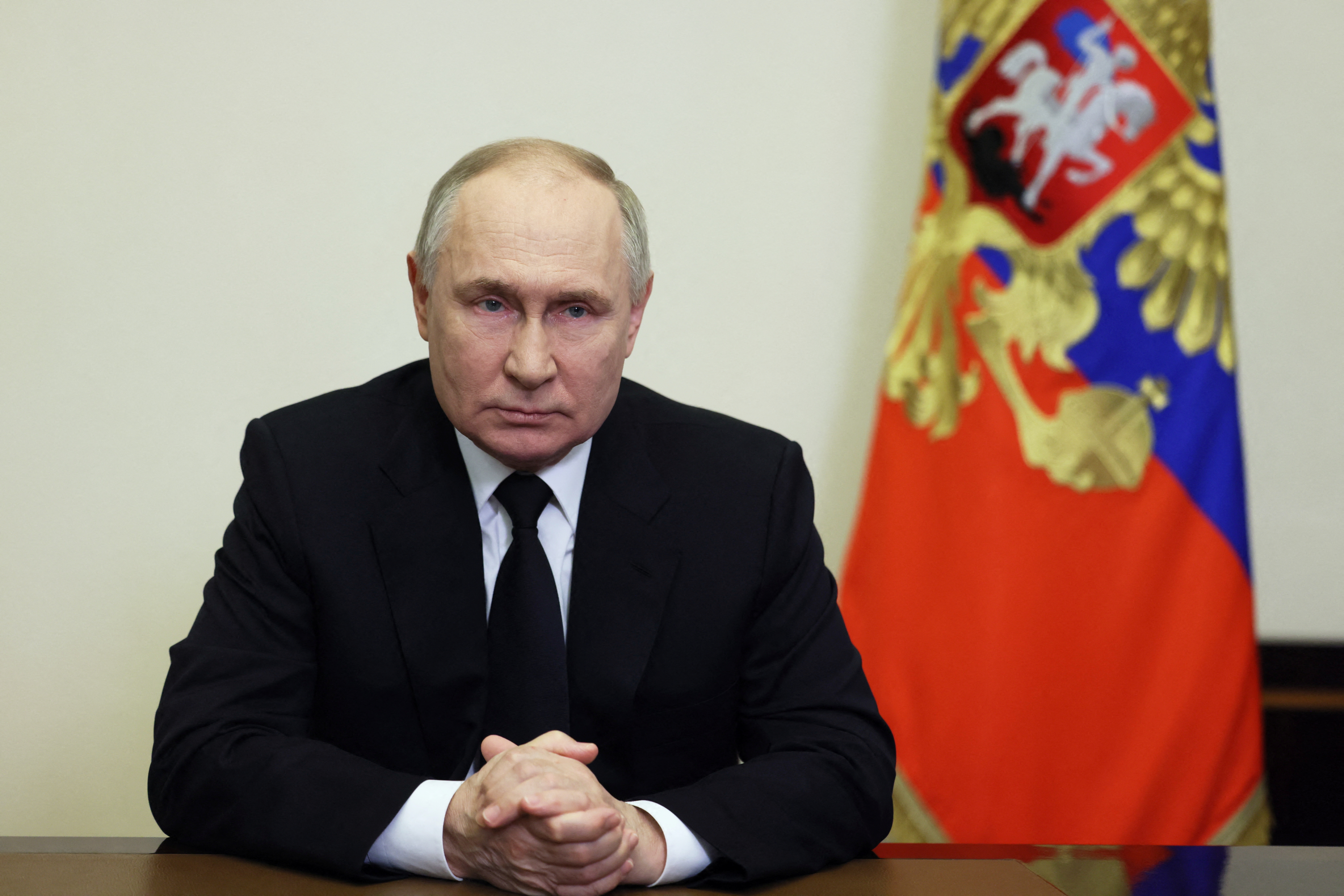 Russian President Vladimir Putin delivers a video address to the nation