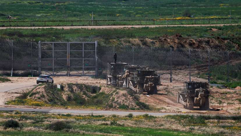 Israeli military bulldozers maneuver near Israel's border with Gaza