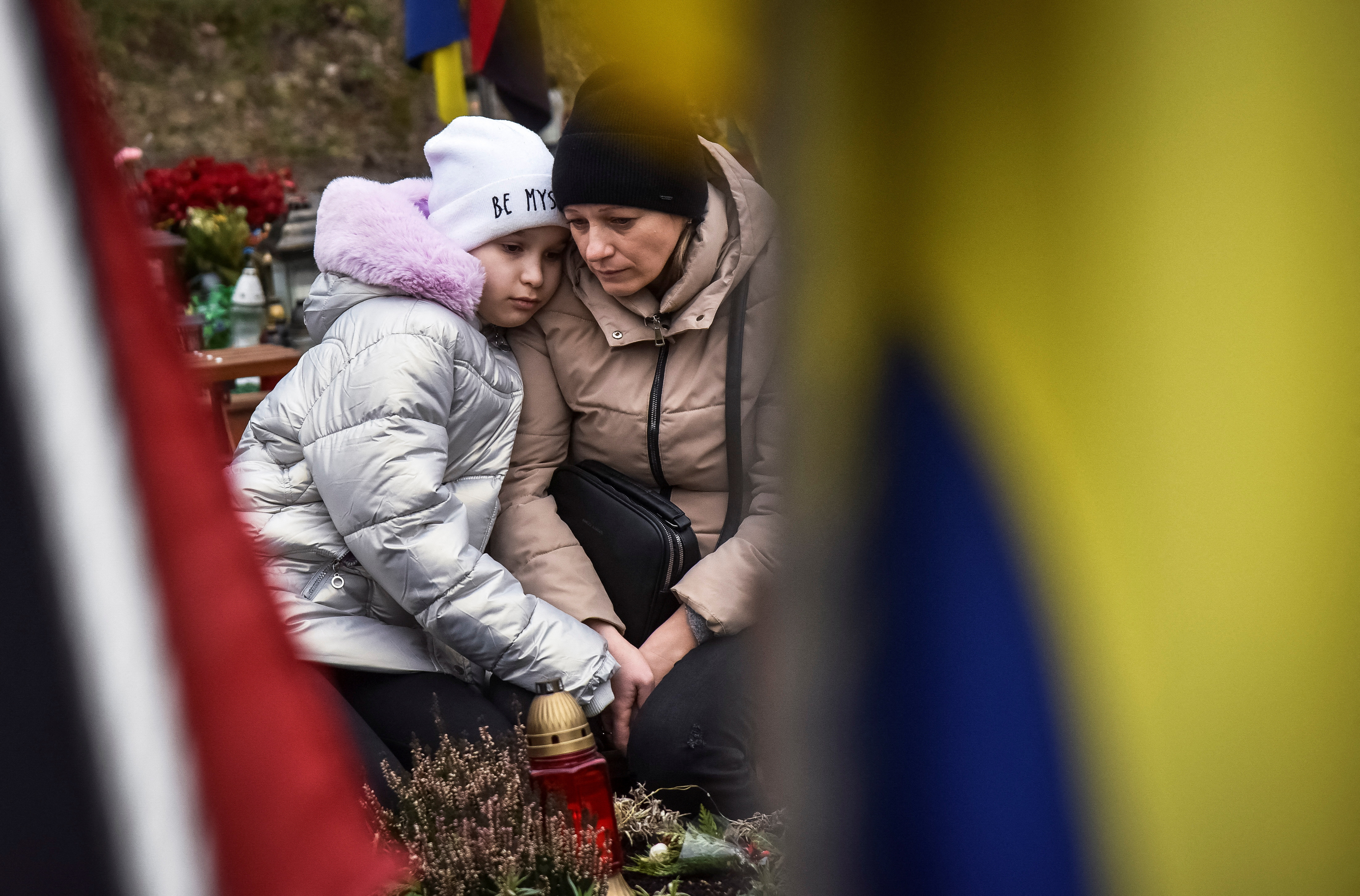 People visit graves of killed Ukrainian defenders, on the day of the second anniversary of Russia's attack on Ukraine, in Lviv