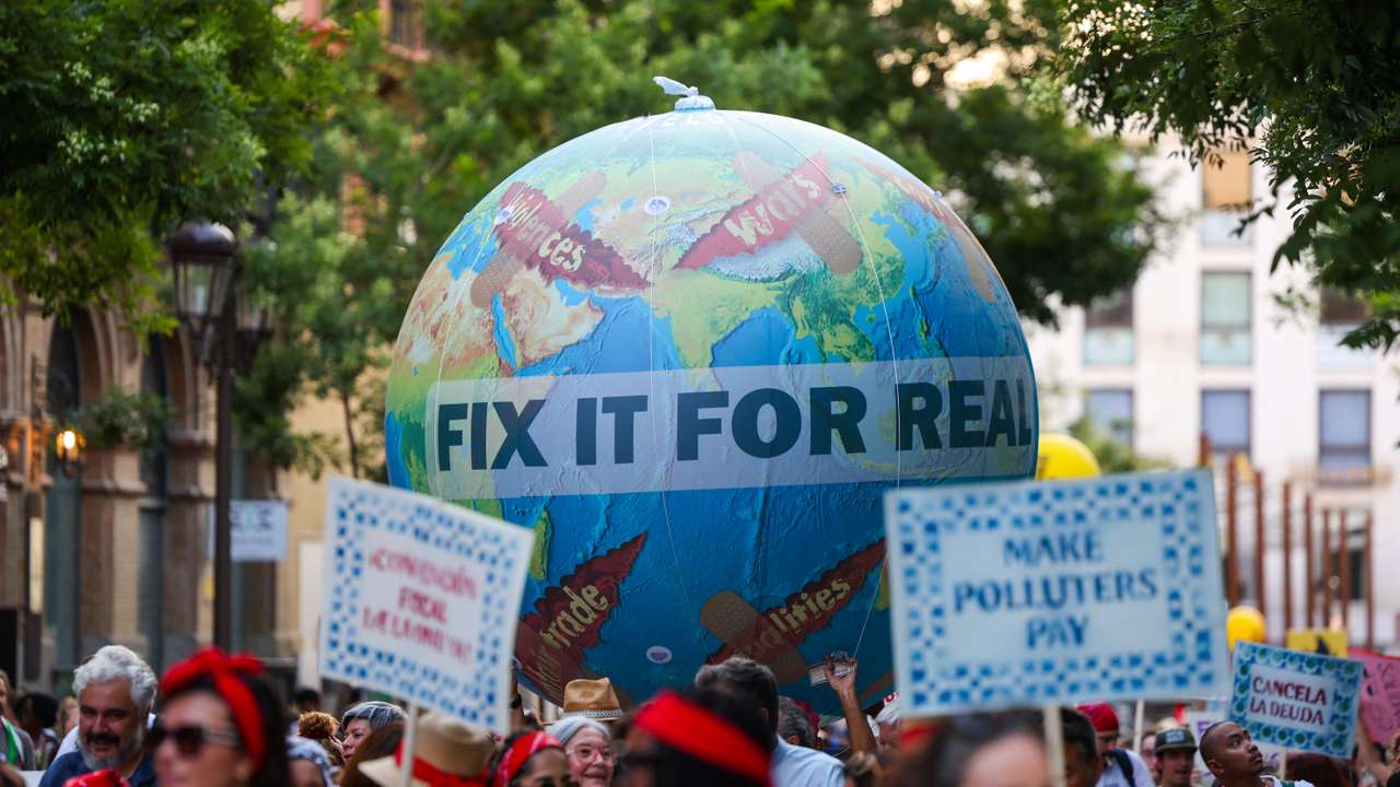 March demanding a UN-led framework for sovereign debt resolution, in Seville