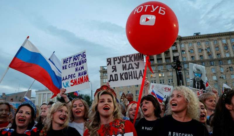 FILE PHOTO: Spectators gather before a concert held in protest against blocking of Russian users' channels on YouTube, in Moscow
