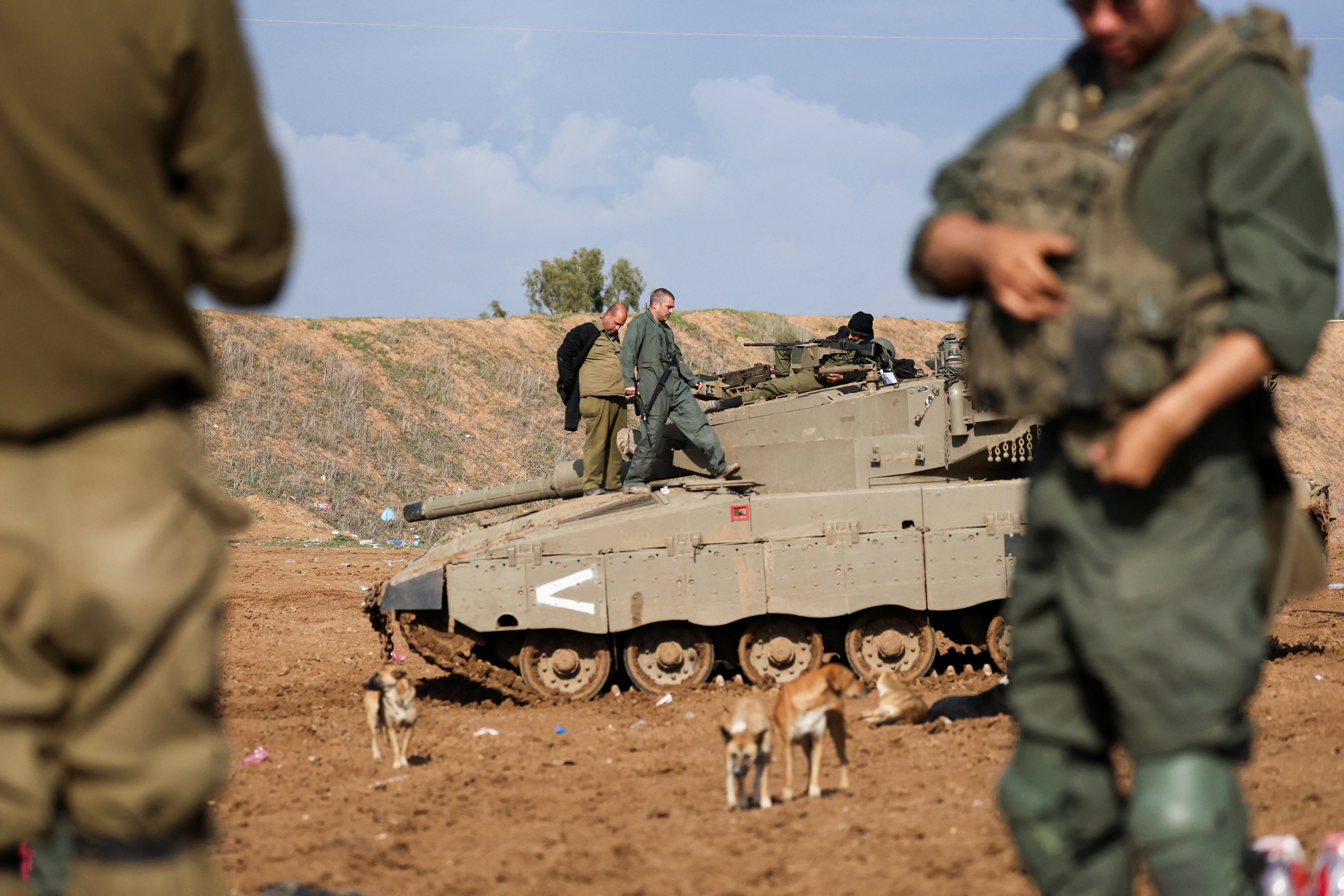 Israeli soldiers fire mortar shells near Israel's border with Gaza in southern Israel