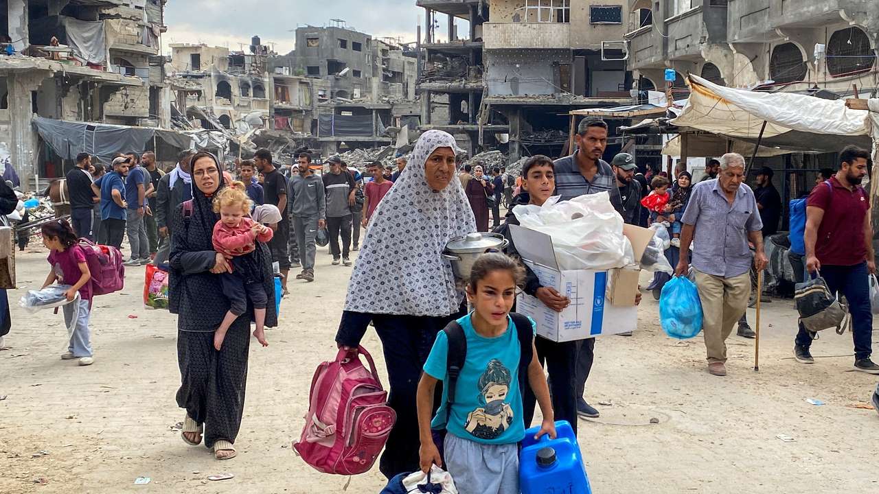 Displaced Palestinians flee areas in northern Gaza Strip following an Israeli evacuation order, in Gaza
