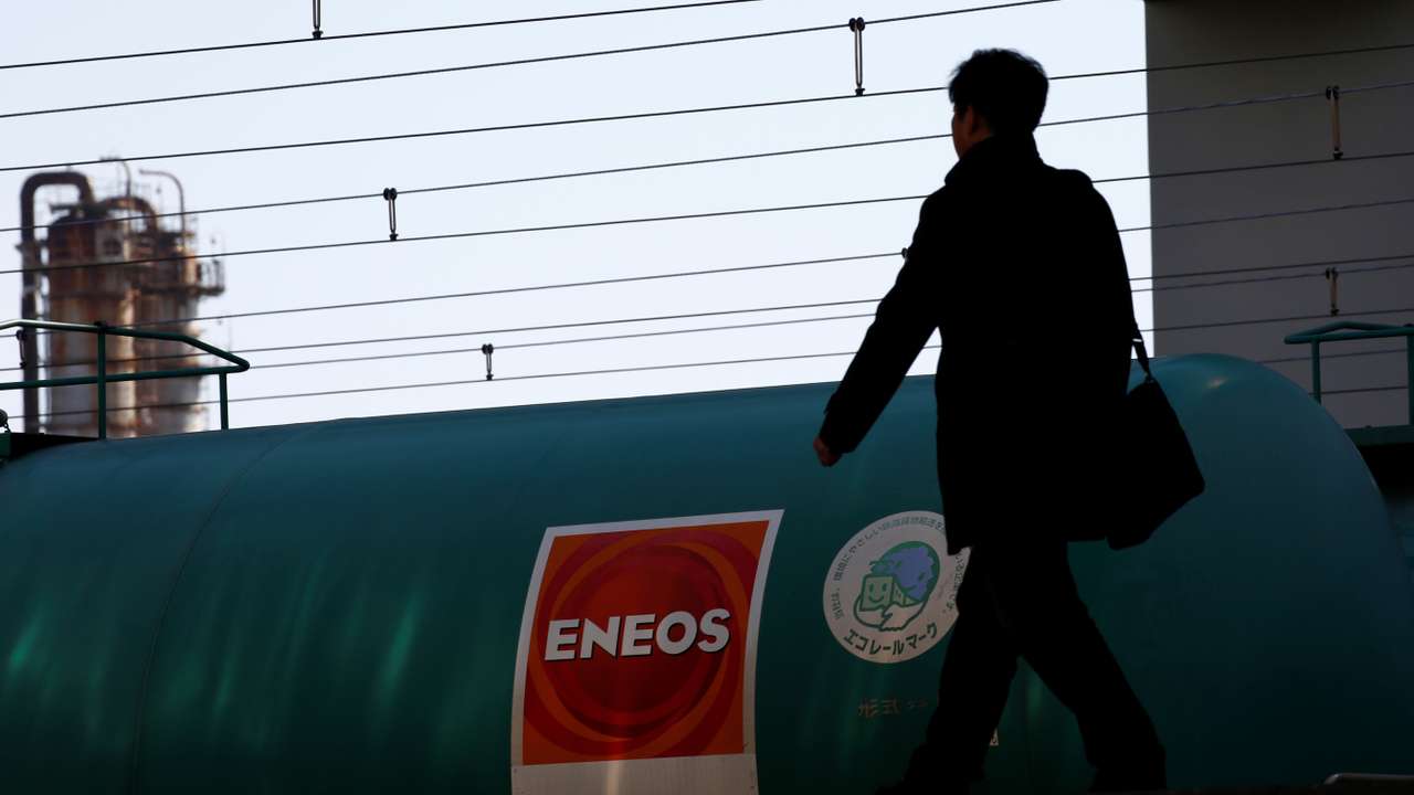 JX Nippon Oil & Energy Corp's Eneos brand logo on a tanker lorry in a train at a station nearby its refinery in Yokohama